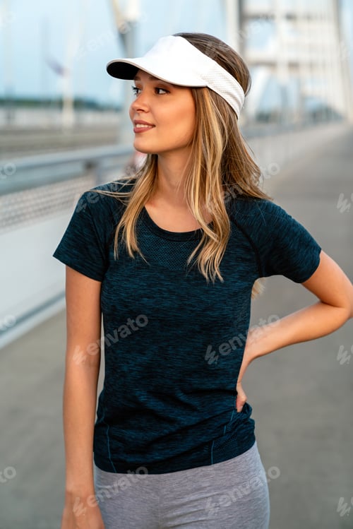Preview: Portrait of young fit attractive happy fitness woman in city. People healthy lifestyle concept