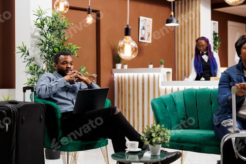 Preview: Entrepreneur working remotely in hotel