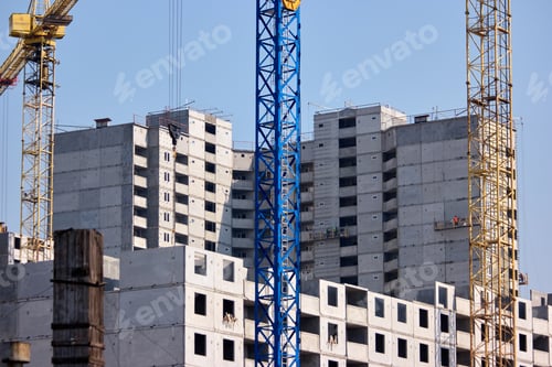 Preview: Unfinished cement building at a construction site.