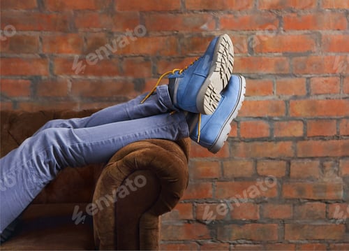 Preview: Half body of a female, posing her jeans and boots