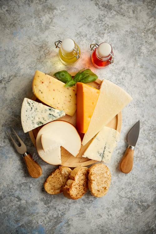 Preview: Various types of cheese served on rustic wooden board