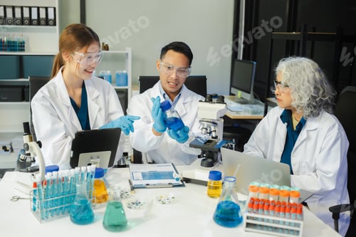Preview: Scientist mixing chemical liquids in the chemistry lab.