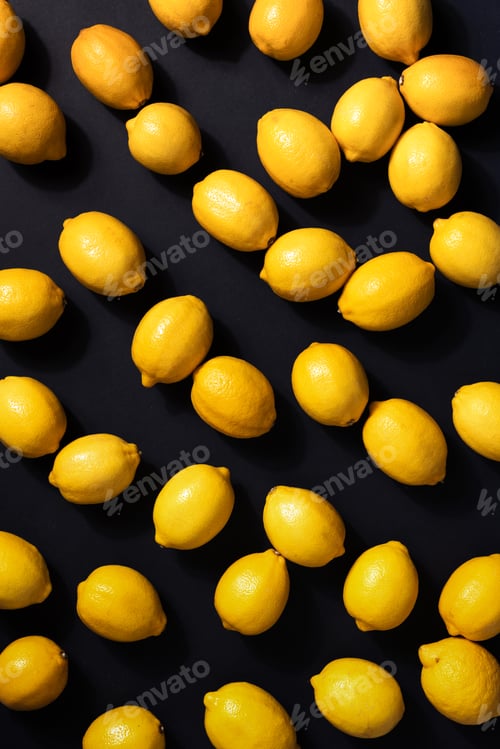 Preview: Immune system booster. Fresh lemons pattern on black background.