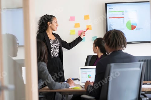 Preview: Businessman and businesswomen, sitting in office, having discussion, brainstorming