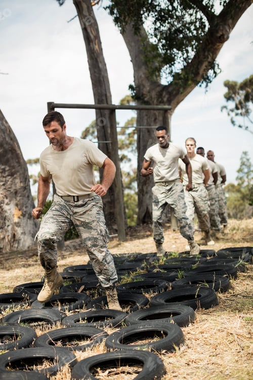 Preview: Young military soldiers practicing tyre obstacle course