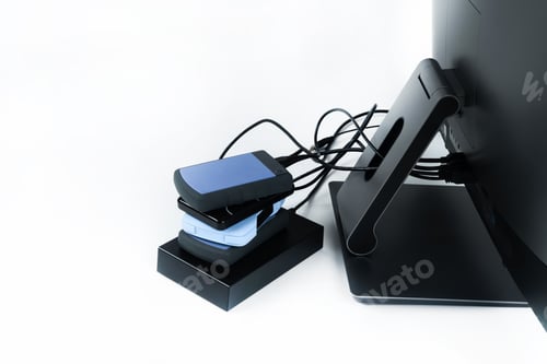 Preview: Multiple external hard drives connected to a monoblock on a white background.Computer with hard