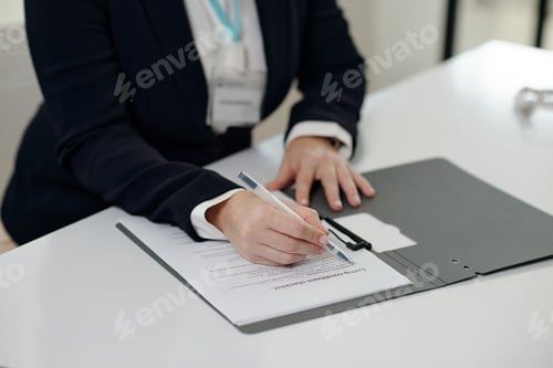 Preview: Social Worker Signing Application In Office