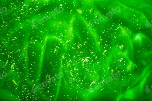 Visualização: Close-up macro Aloe vera gel textura cosmética fundo azul com bolhas