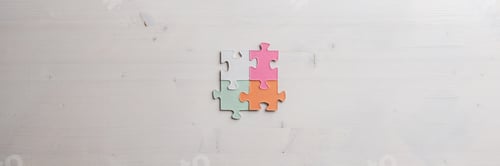 Preview: Four blank puzzle pieces of various pastel colours joined together