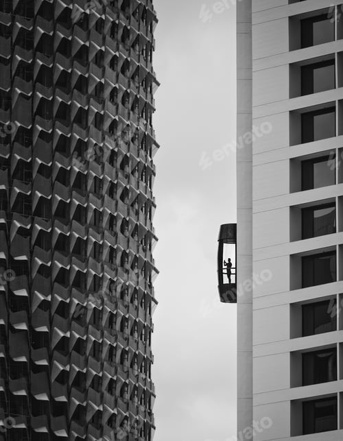 Preview: Contemporary cityscape featuring a large, glass elevator next to a towering skyscraper