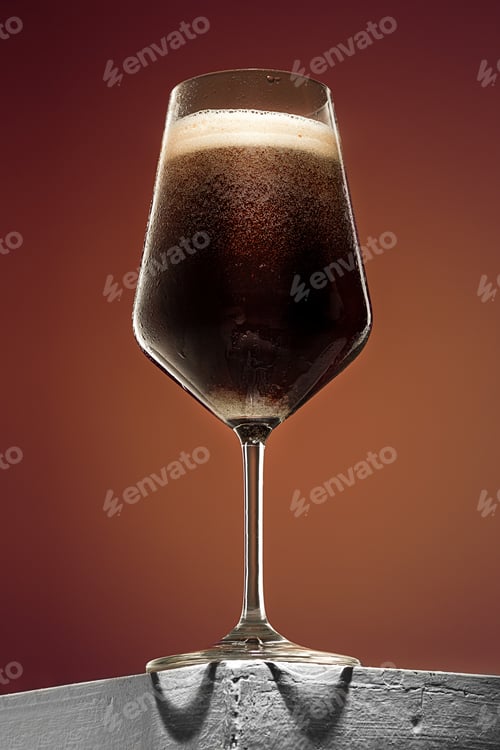 Preview: Glass Of Cold Frothy Dark Beer On An Old Wooden Table