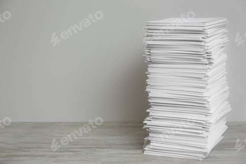 Preview: Stack of paper sheets on wooden table. Space for text
