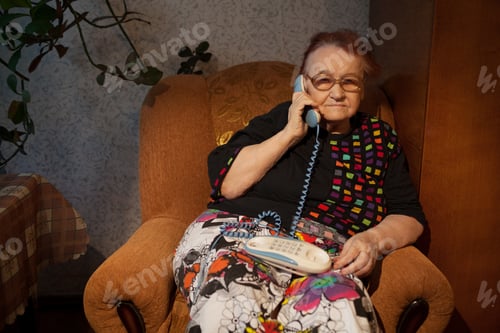 Preview: Elderly woman talking on the home phone