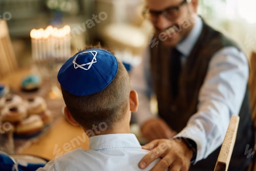 Preview: Rear view of Jewish boy talking to his father.