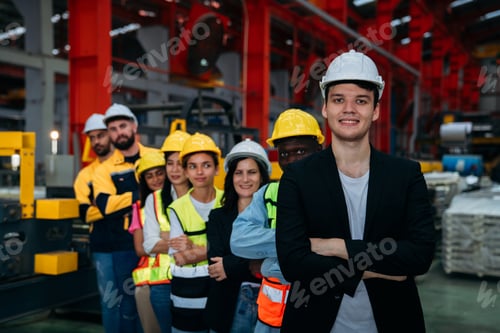 Preview: Portrait of industrial worker inspecting and check up machine at factory machines.