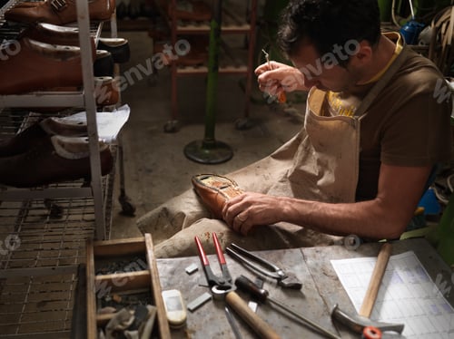 Preview: adult man working in a shoe factory