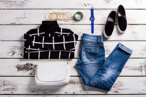 Preview: Lady's checkered sweater and jeans.