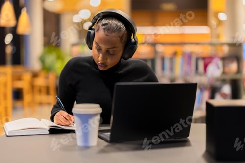 Preview: Student studying diligently in a library