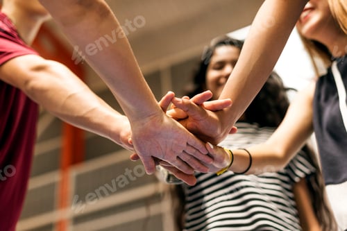 Preview: Group of teenager friends on a basketball court teamwork and togetherness concept
