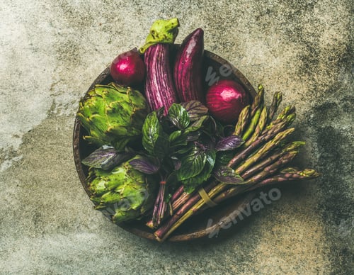 Preview: Flat-lay of green and purple vegetables on plate, grey background