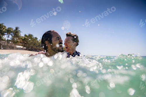 Preview: Couple splashing in sea, Pagudpud, Ilocos Norte, Philippines