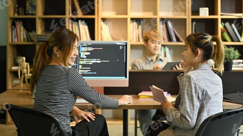 Preview: Group of IT developer working on new project together in creative office.