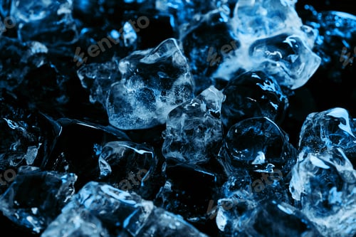 Preview: frozen clear ice cubes with blue lighting isolated on black
