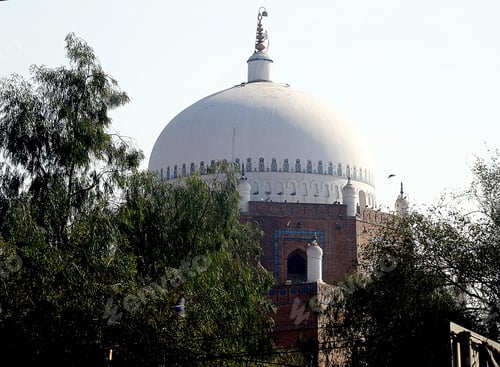 Preview: Beautiful shot of a dome in Multan Pakistan with trees in front and the blue sky in the background