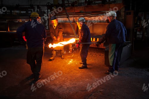 Preview: Red hot steel billet which has already been partially pre formed is moved back in to the furnace