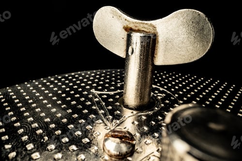 Preview: Winding key in watch in dark macro
