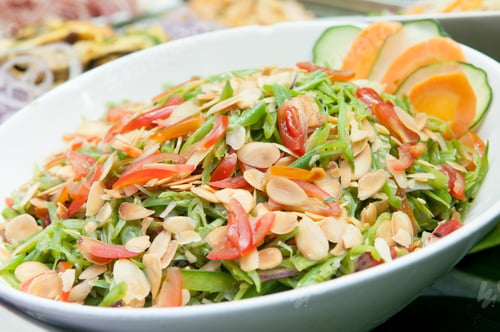 Preview: Closeup shot of a colorful spring salad with chopped vegetables and nuts