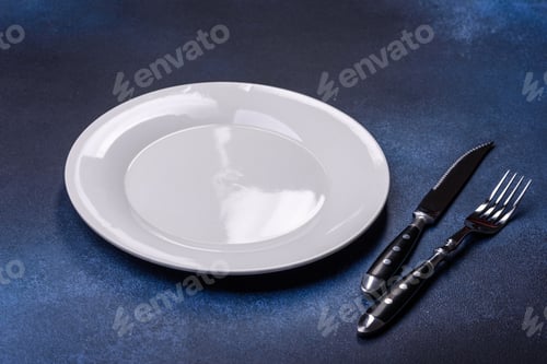 Preview: Empty white plate on blue background table