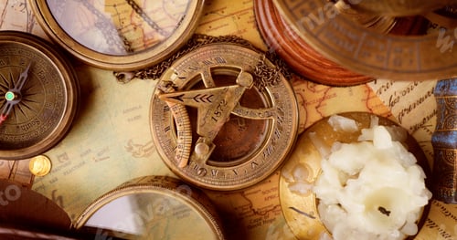 Preview: Vintage style travel and adventure. Vintage old compass and other vintage items on the table.