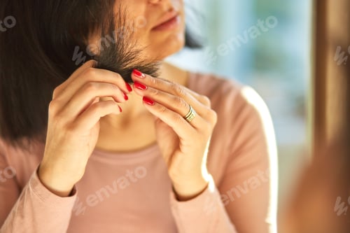 Preview: Problem damaged hair concept, Pretty Brunette woman brushing hair with comb