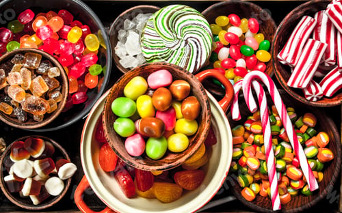 Preview: sweets candy, candied fruits with marshmallow and jelly on a wooden tray.