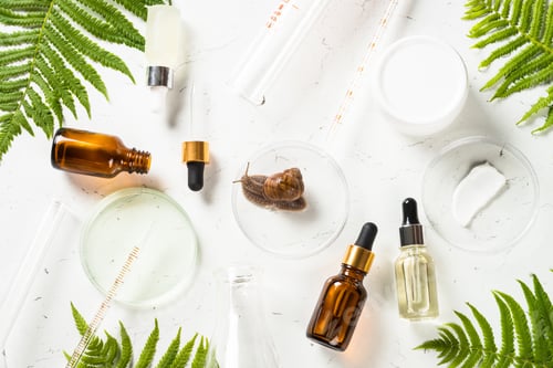 Preview: Snail mucin products at white background. Natural cosmetic