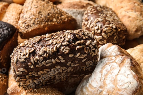 Preview: Different kinds of fresh bread as background, closeup