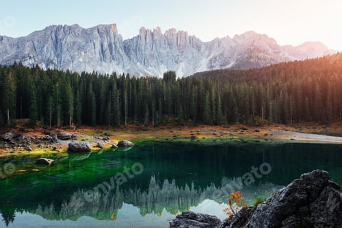 Preview: Autumn landscape with clear lake, fir forest and majestic mountains