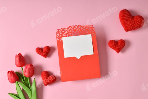 Preview: A mock-up of a kraft envelope with a blank sheet, tulips and knitted hearts.
