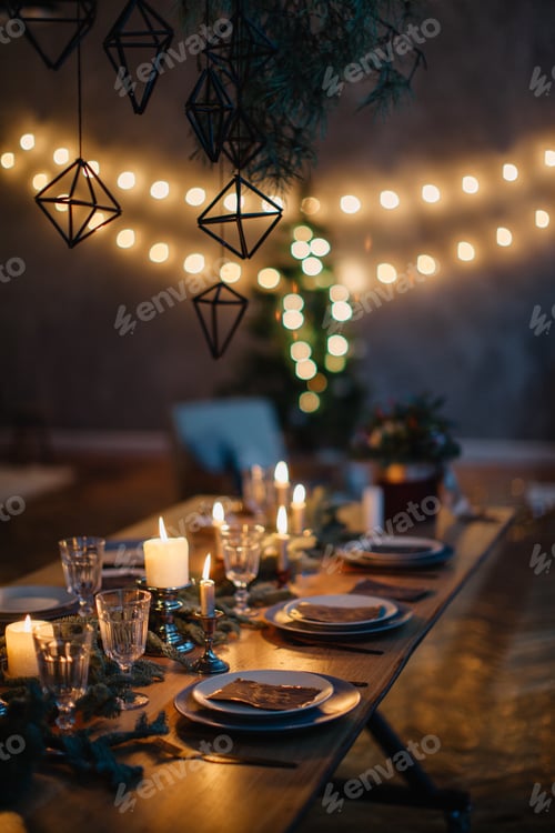 Preview: Festive table setting in evening light at home.