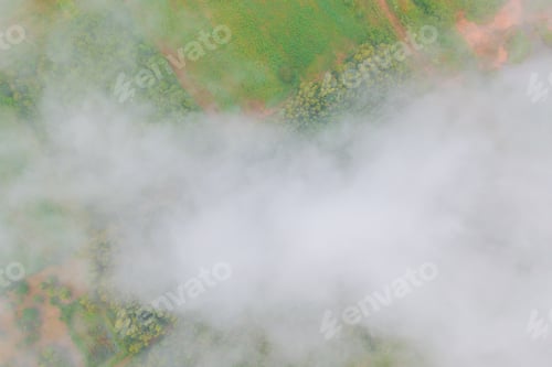 Preview: Aerial view of sunrise above fluffy sea fog misty clouds with mountain hill. Nature landscape