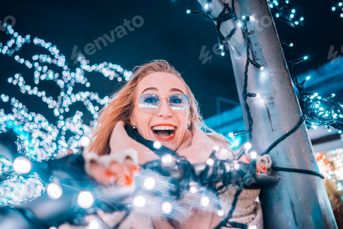 Preview: Girl posing against the background of decorated trees