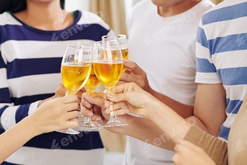 Preview: Party guests drinking champagne at party