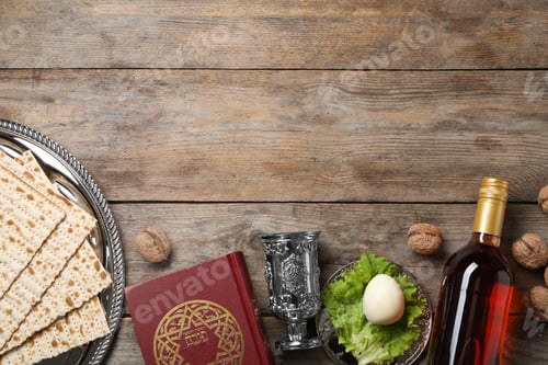 Preview: Flat lay composition with symbolic Passover (Pesach) items on wooden background, space for text