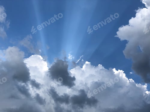 Preview: The textured background is a celestial landscape with thunderclouds, rays of sunlight. Concept.