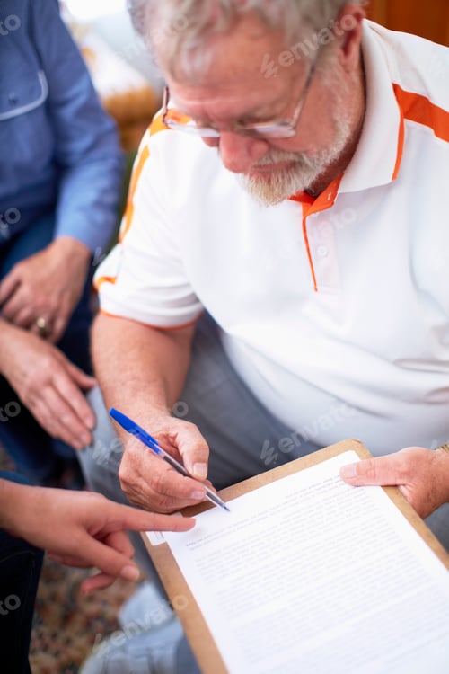 Preview: Senior man signing document