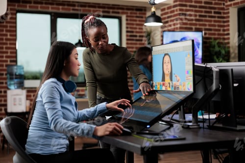 Preview: Creative agency professional retouchers editing digital photos while using specialized software