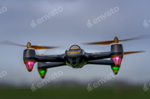 Preview: Soft focus of a drone flying over a field - surveillance concept