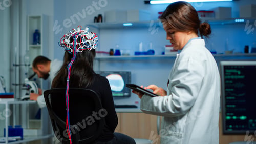 Preview: Back view of woman patient wearing performant eeg headset