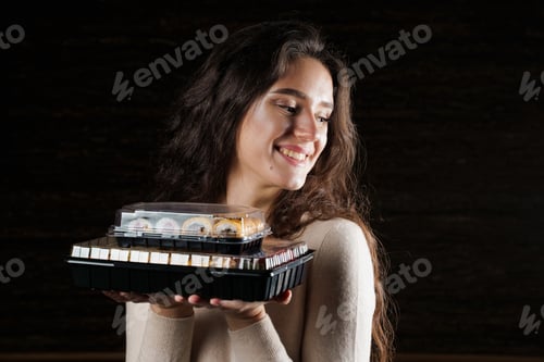 Preview: Food courier girl delivers 2 sushi boxes. Quarantine safe contactless delivery.